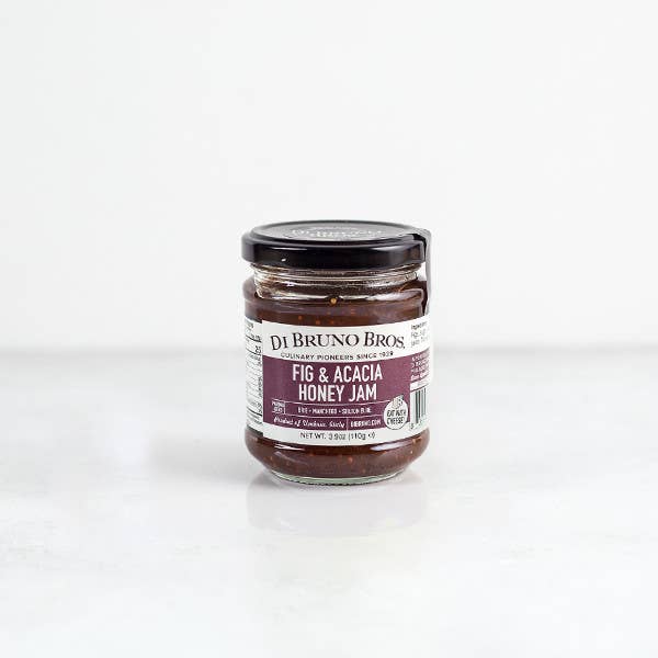 Fig and Acacia Honey Jam by Di Bruno Bros in a glass jar.