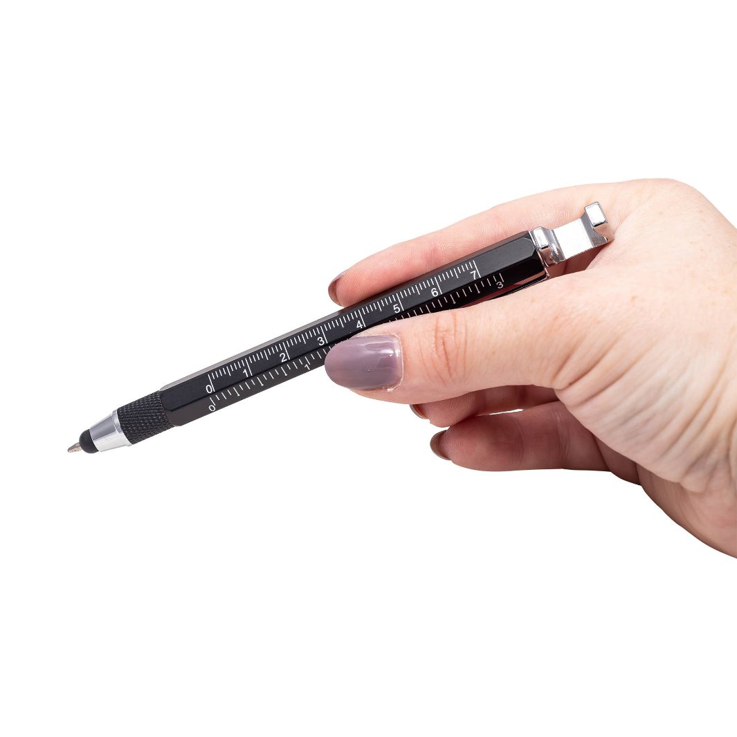 A person holding the Friken Cool Pen, showcasing its sleek design and multitool features including a stylus, ruler, and screwdriver.