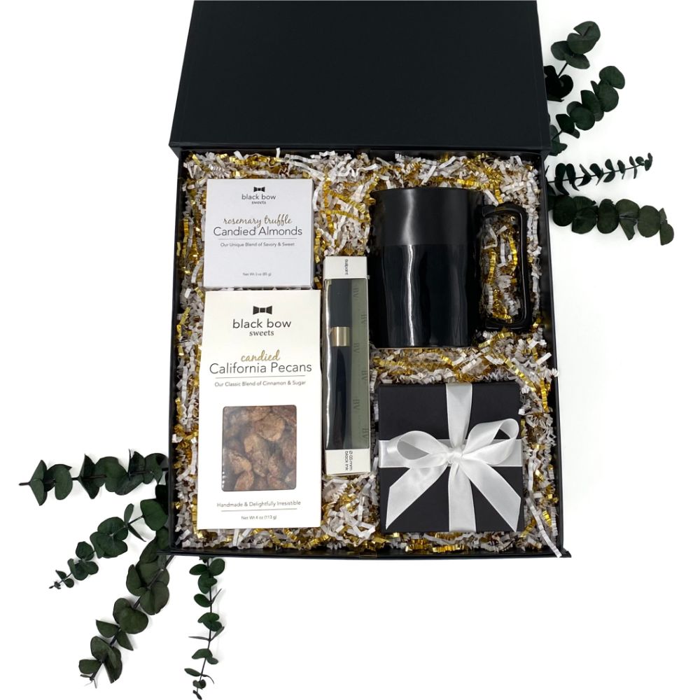 Big Ideas Gift Box with abundance candle, black mug, pen, and gourmet snacks.