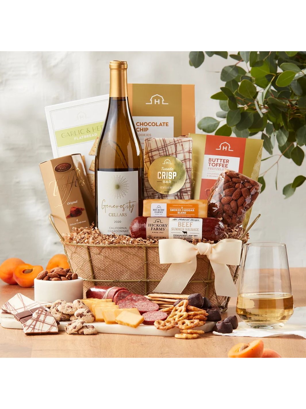 California Gourmet Wine Gift Basket featuring Generosity Cellars Chardonnay and gourmet snacks in a gold metal basket.