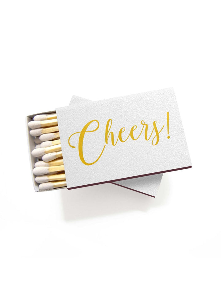 Cheers Matchbook with metallic gold foil on shimmer white, featuring 22 white-tipped matches for elegant candle lighting or celebrating special moments.