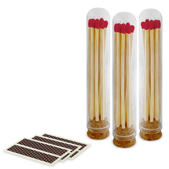 Cherry red-tipped matches displayed in a mini glass cloche with cork lid