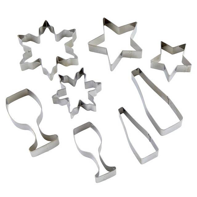 Christmas cookie cutter set with wine bottle, glass, snowflake, and star shapes.