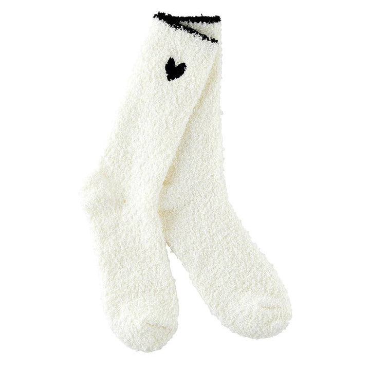 White cozy socks featuring black trim and a black heart detail, ideal for winter warmth and holiday gifting.