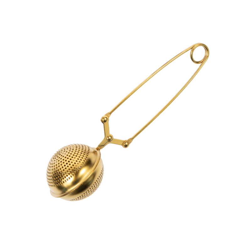 Gold tea infuser for brewing loose leaf tea.