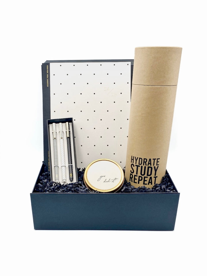 Scholarly Success Gift Box with planner, pen set, water bottle, and candle.