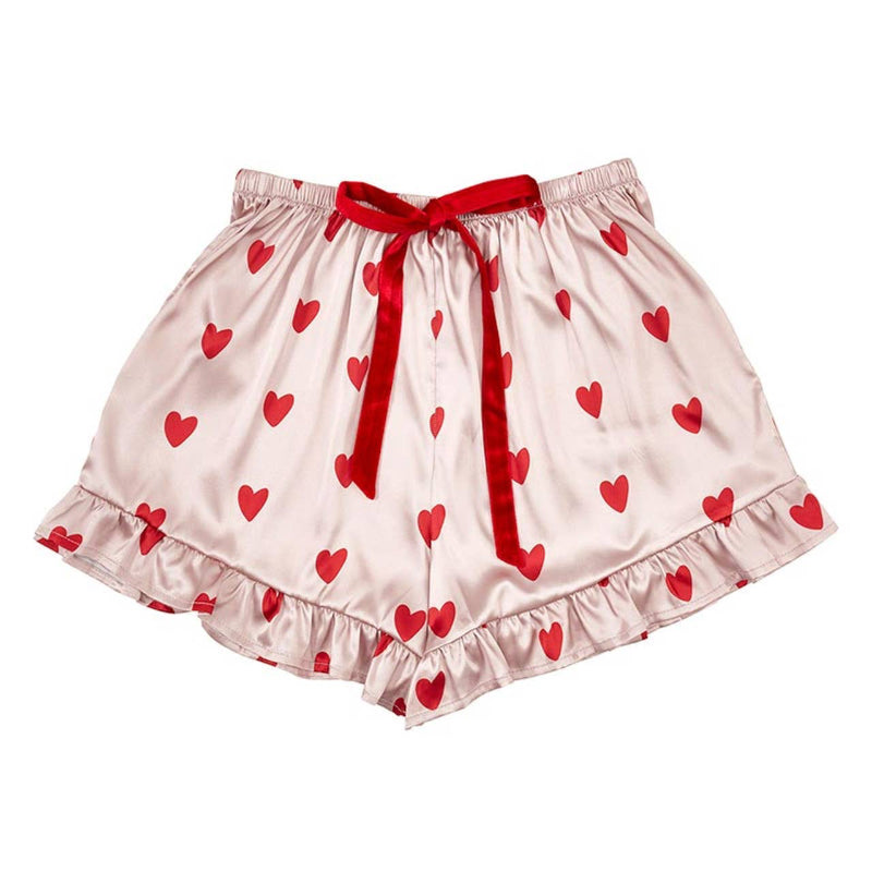 Coordinating pink satin pajama shorts with red heart print, a ruffled hem, and a red velvet ribbon tie at the waistband for a stylish and cozy fit.