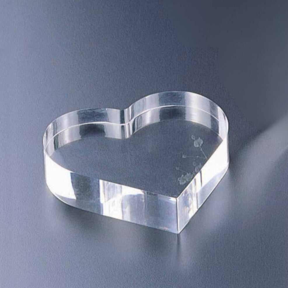 Close-Up of Heart Paper Weight: Transparent acrylic design showcasing smooth edges and elegant detailing.