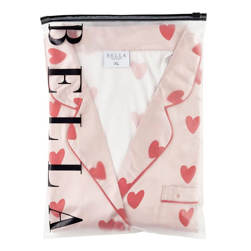 Beautifully packaged Hearts Two-Piece PJ Set, neatly folded and wrapped for gifting, showcasing the pink satin fabric with red hearts.