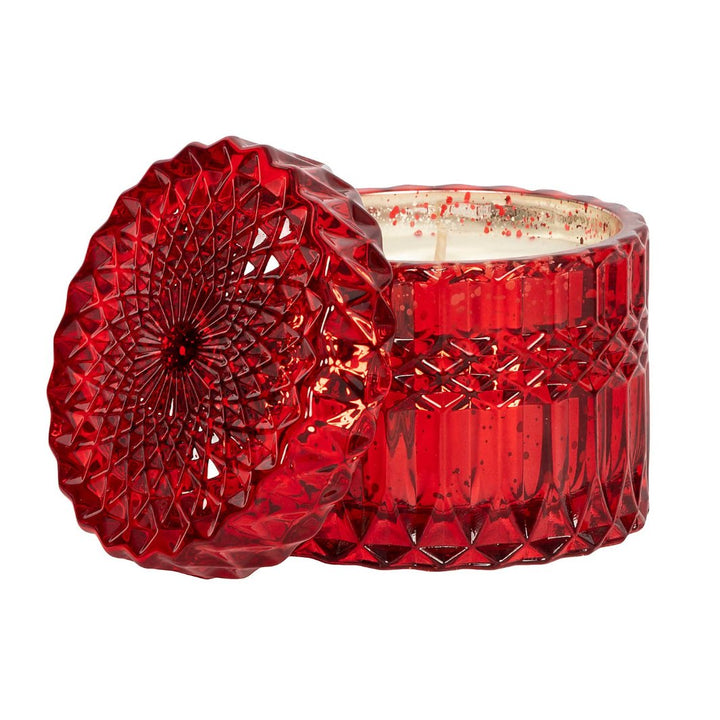 Holiday Spice Shimmer Candle in red crystal glass with festive scent notes.