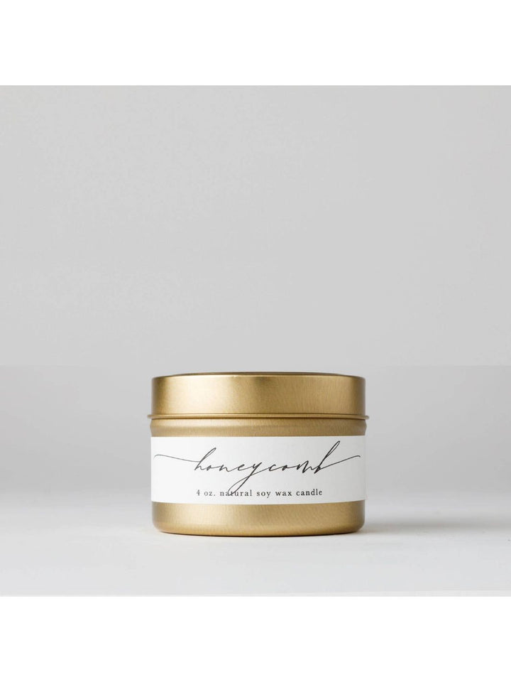 Honeycomb candle in brushed gold travel tin.