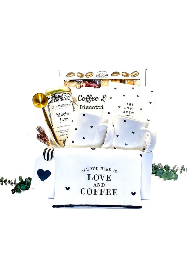 Love & Coffee Gift Box with Artisan Heart Mugs, "All You Need Is Love And Coffee" Tea Towel, "Let Love Brew" Cocktail Napkins, Brushed Brass Coffee Clip + Scoop, Mocha Java Ground Coffee, Coffee Lover's Biscotti 4 Pack, and Rock Candy Barista Swizzle Sticks