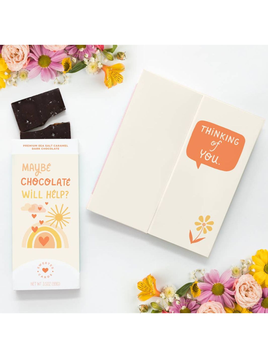 Greeting card with sea salt caramel dark chocolate bar. Outside states "Maybe Chocolate Will Help?". Inside of card states "Thinking of You".