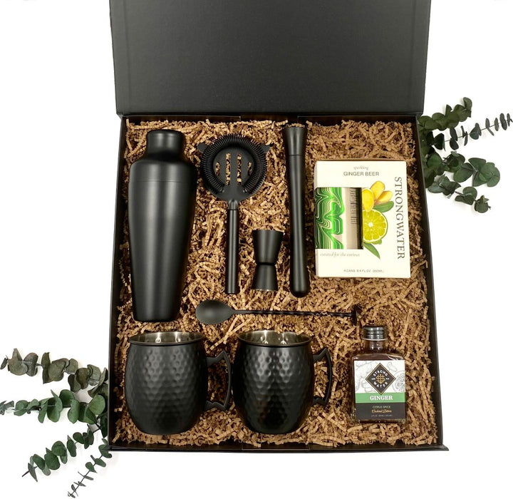 Moscow Mule Gift Box includes two Houdini black matte hammered Moscow mule mugs, coordinating Houdini Noir matte black shaker set, Strongwater ginger beer and ginger bitters