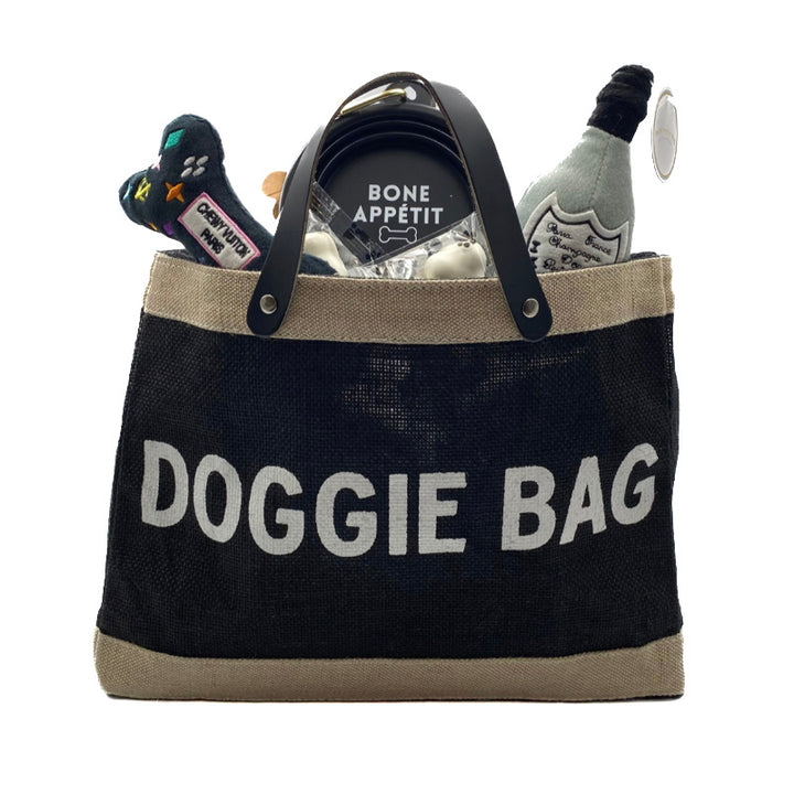 Pampered Pooch Gift Set for small dogs with chic tote, collapsible bowl, gourmet treats, and squeaky toys.