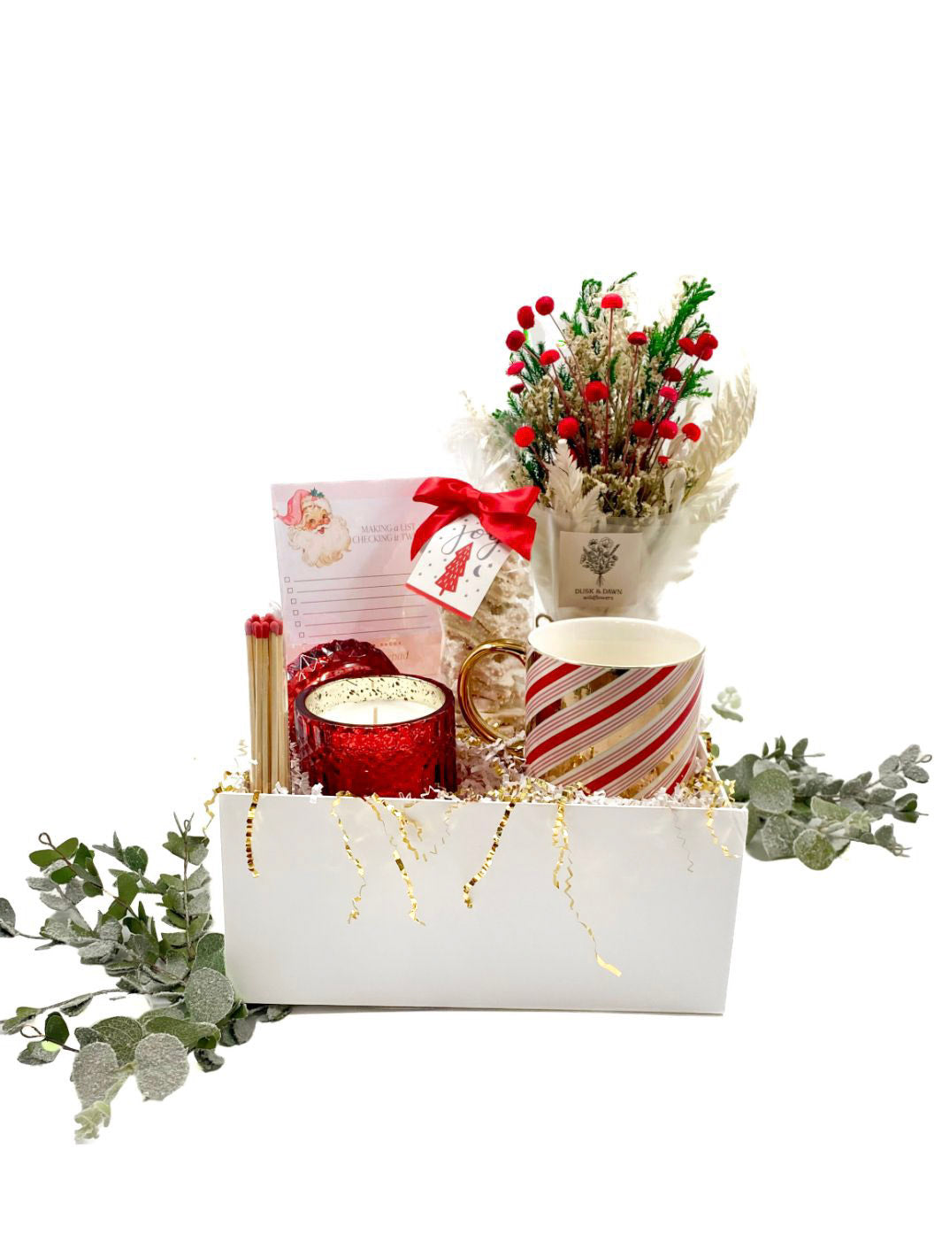 Peppermint Twist Curated Gift Box with a festive mug, candle, matches, notepad, dried bouquet, and holiday treats.