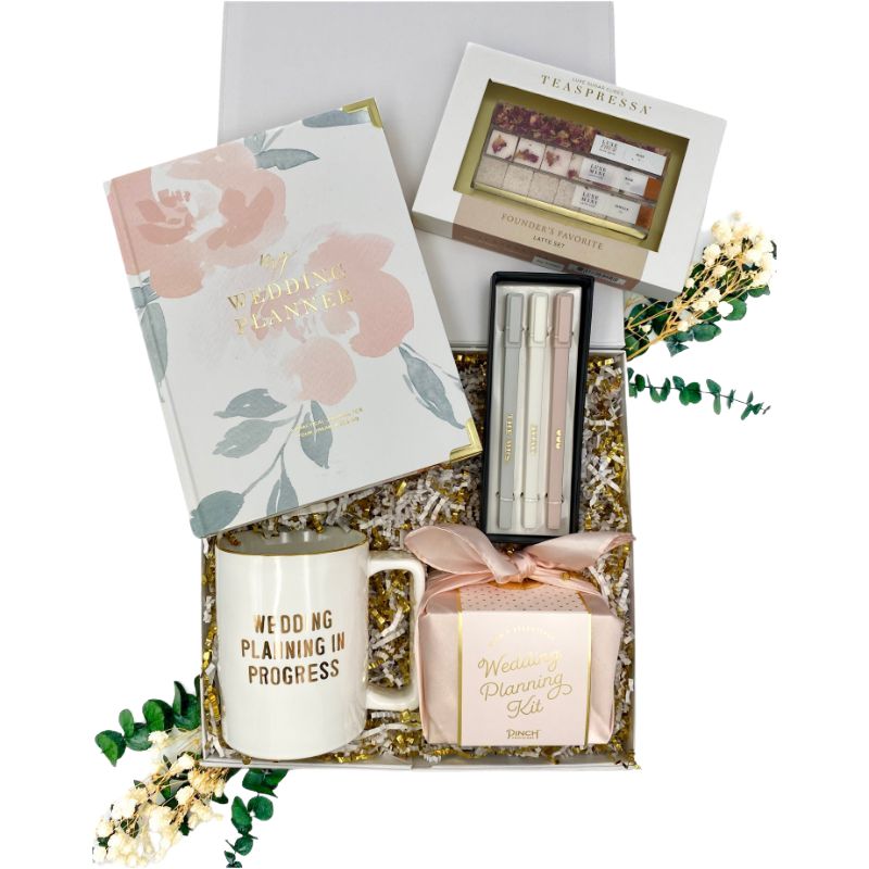 Contents of Perfect Wedding Plan Gift Box Include Wedding Planner, Mug, Wedding Planning Kit, Pen Set and Founder's favorite tea set by Teaspressa. 