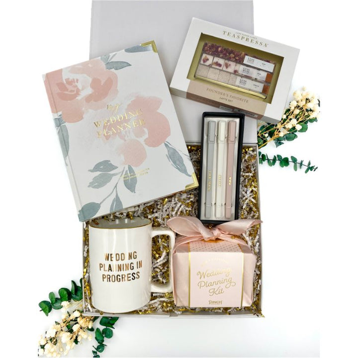 Contents of Perfect Wedding Plan Gift Box Include Wedding Planner, Mug, Wedding Planning Kit, Pen Set and Founder's favorite tea set by Teaspressa. 