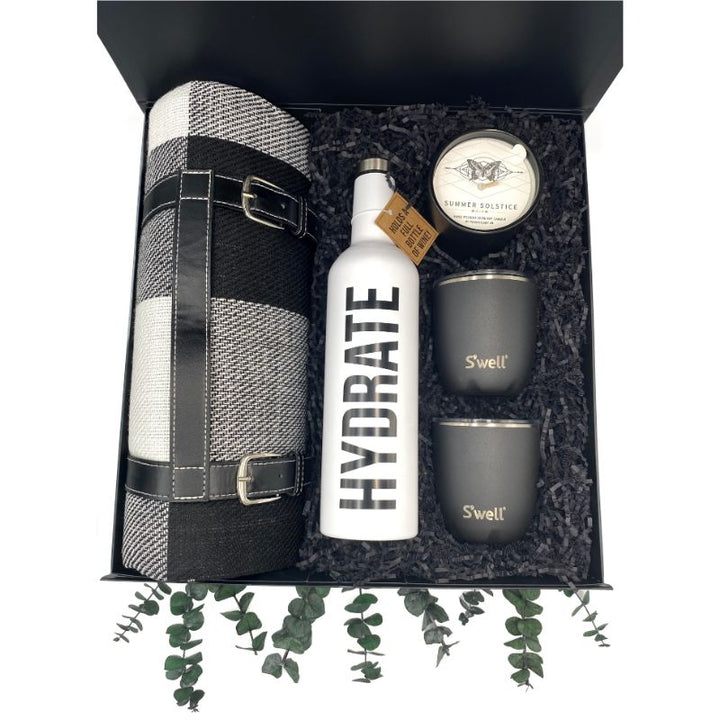 Picnic Party Gift Box with Buffalo Check Picnic Blanket, Stainless Steel Wine Bottle, Onyx Tumblers, and Summer Solstice Candle.