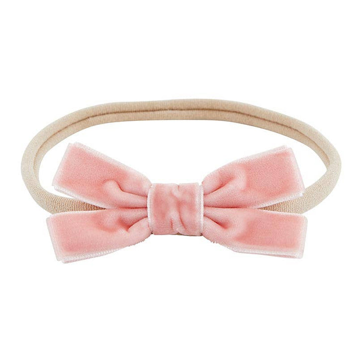 Soft baby headband with pink velvet bow. 