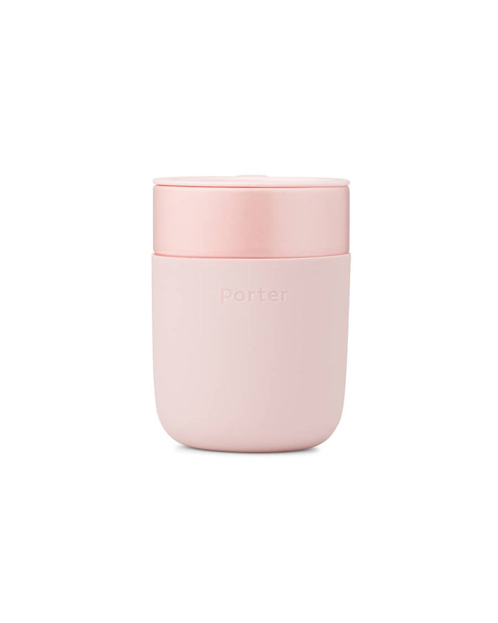 Reusable Ceramic Mug in Blush color with splash-resistant lid and silicone sleeve, customizable with your logo.