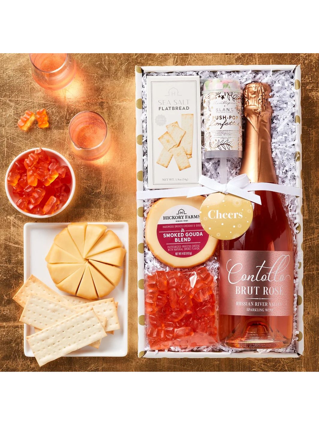 Beautifully arranged Sparkling Rosé Gift Box with snacks and wine, ready for gifting.