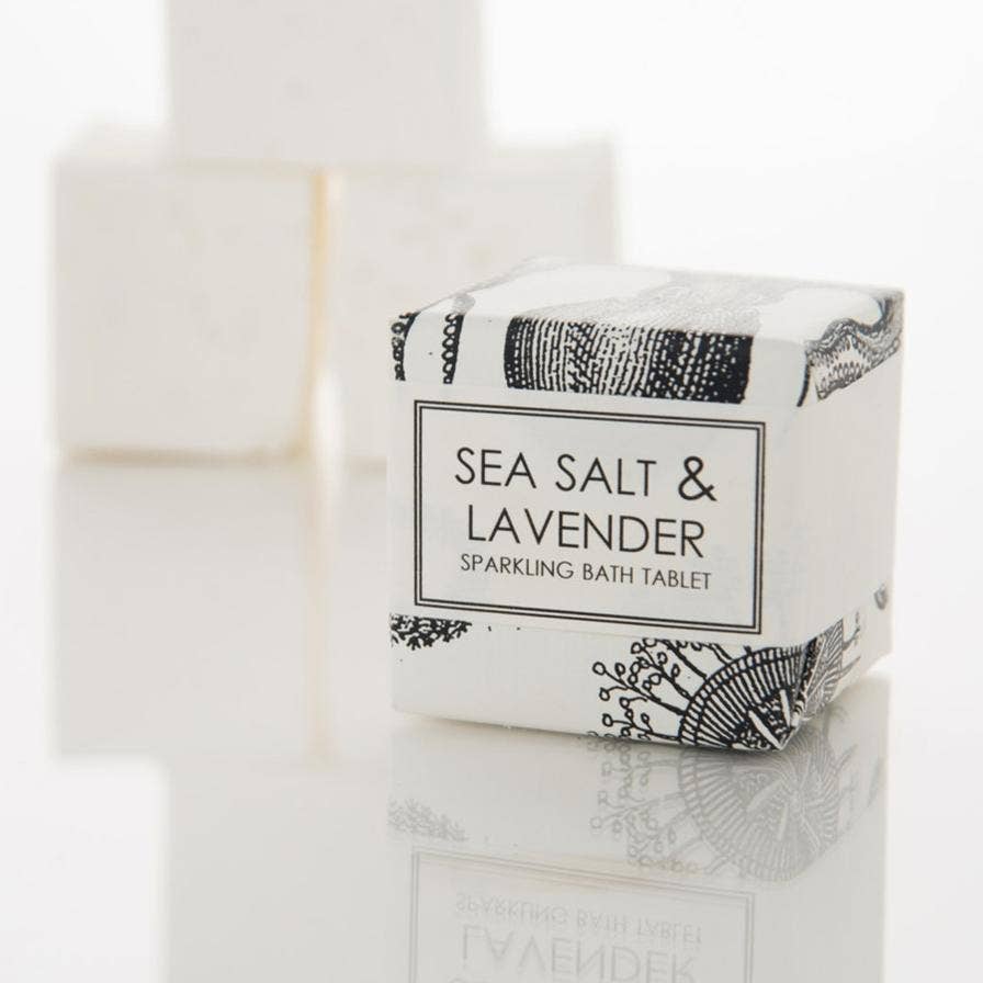 Sea Salt & Lavender Sparkling Bath Tablet by Formulary 55, an 8oz tablet that fizzes and dissolves in water for a relaxing bath. Perfect for spa gift baskets and relaxation gifts.