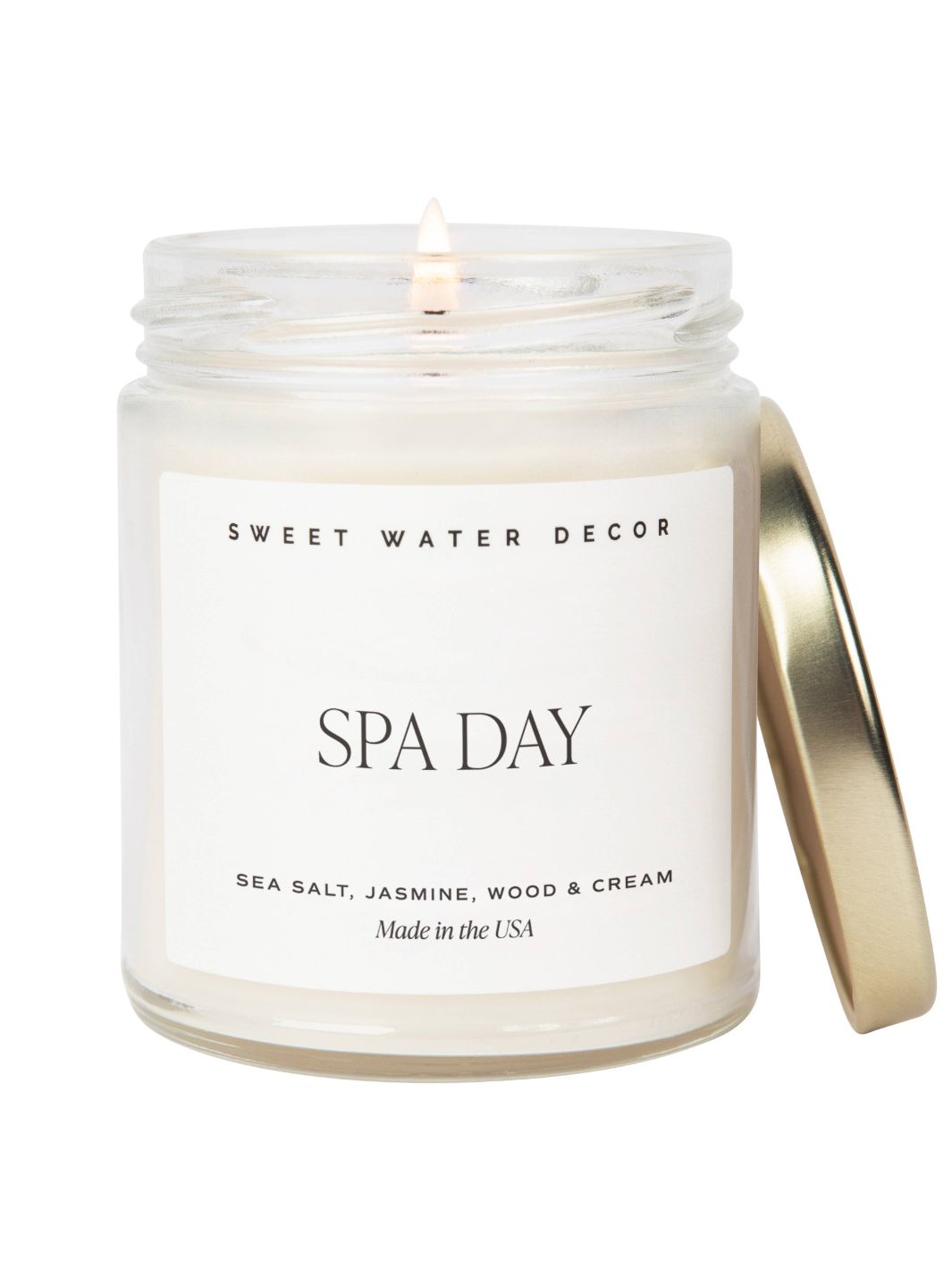 Spa Day Candle by Sweet Water Decor, a 9oz soy candle with scents of Sea Salt and Jasmine, providing a relaxing spa-like atmosphere. 