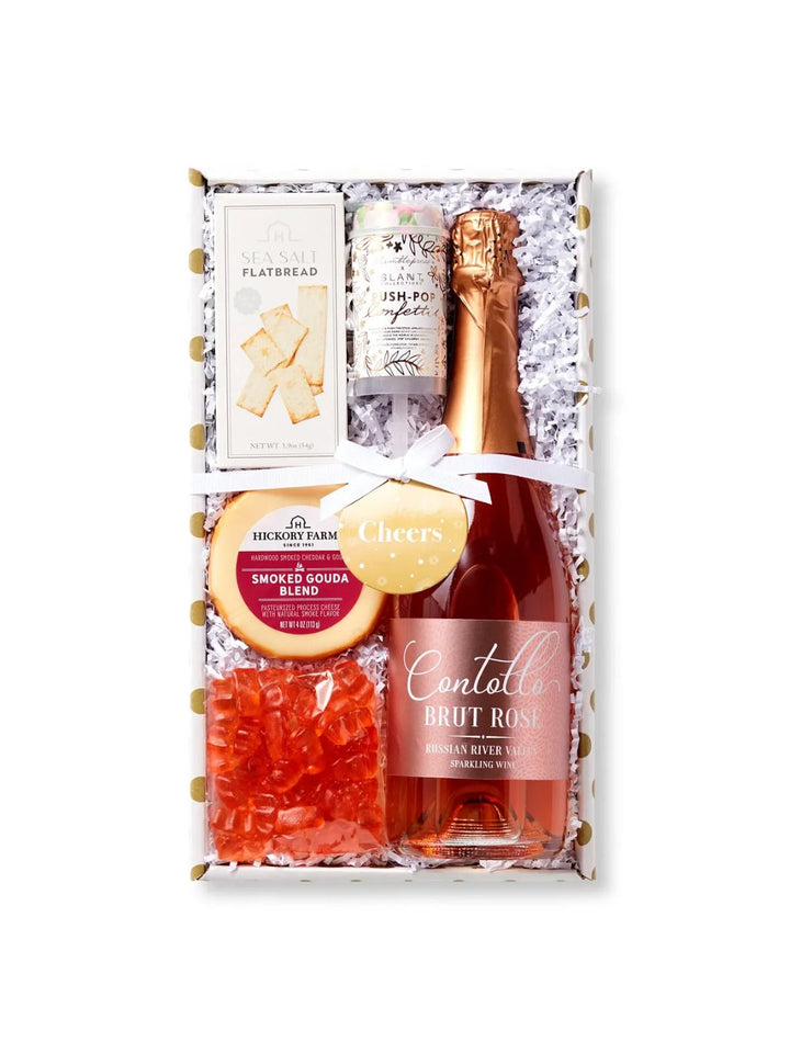 Sparkling Rosé Gift Box featuring Contollo Brut Rosé, Smoked Gouda, crackers, and champagne gummies.