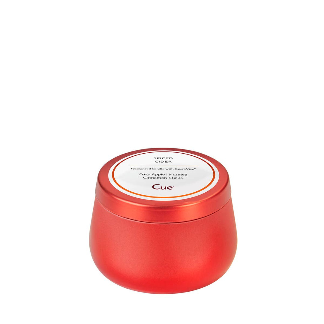 Red tin candle with 20-hour burn time and cozy spiced cider scent.