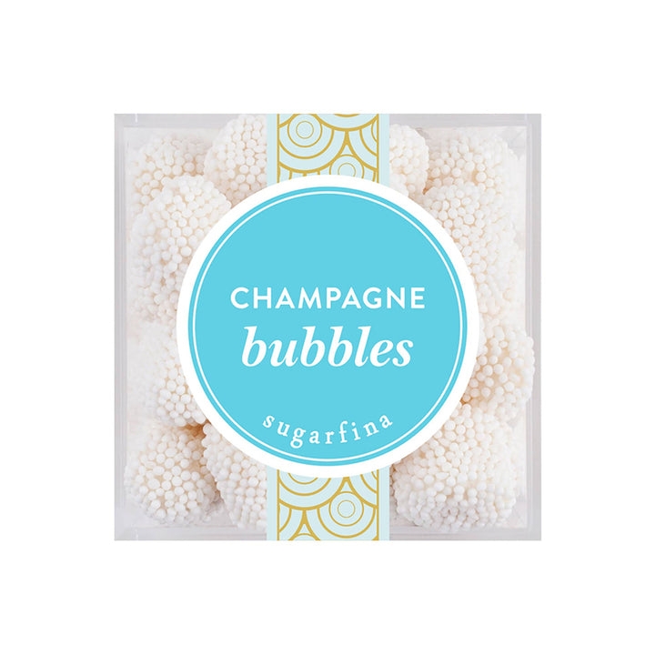 Sugarfina Champagne Bubbles candy cube, elegantly packaged with tiny white nonpareil-coated gummies inside.