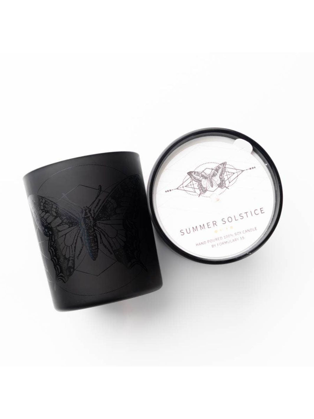 Butterfly Candle in black glass jar with butterfly icon, citrus, ginger, geraniums, patchouli, and lavender aroma.