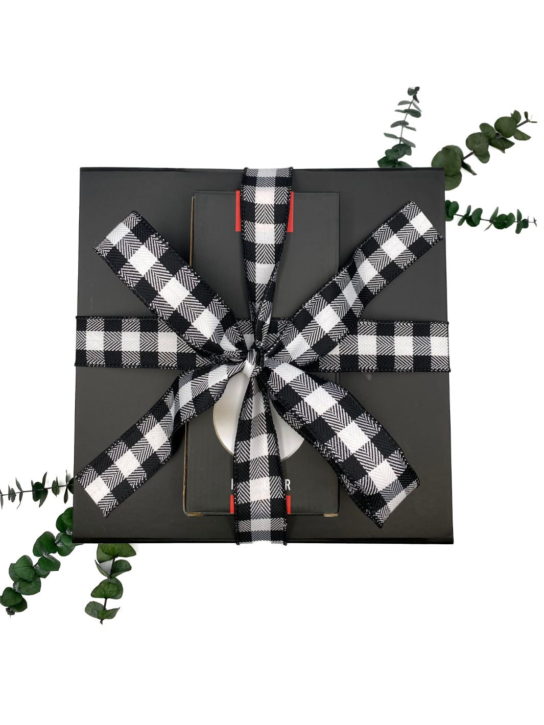 Ultimate Pizza Night Gift Box wrapped with black and white buffalo plaid bow.