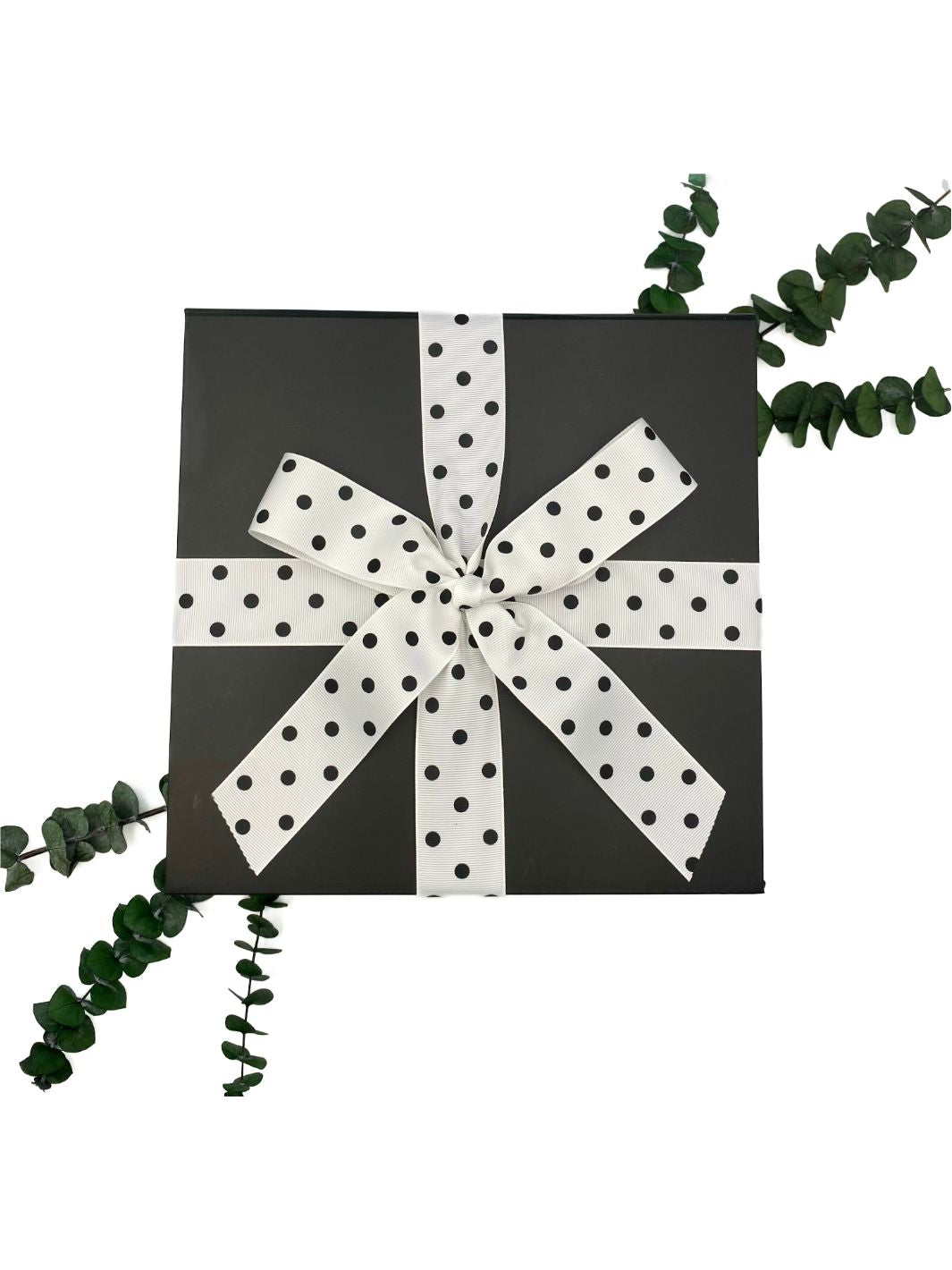 World of Gifting's black metallic closing gift box with black and white polka dot ribbon.