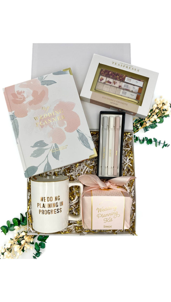 Perfect Wedding Plan Gift Box with wedding planner, pen set, gold foil mug, luxe sugar cube kit, and wedding planning kit.