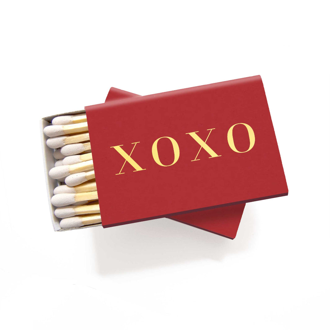 XOXO Matchbox in ruby red with metallic gold foil lettering.