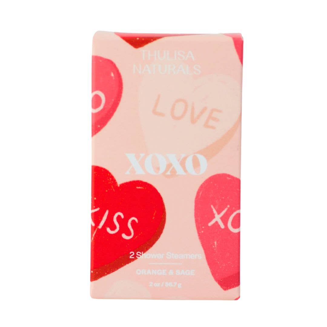 XOXO Shower Steamers 2-pack in eco-friendly packaging, featuring Orange + Sage scent.